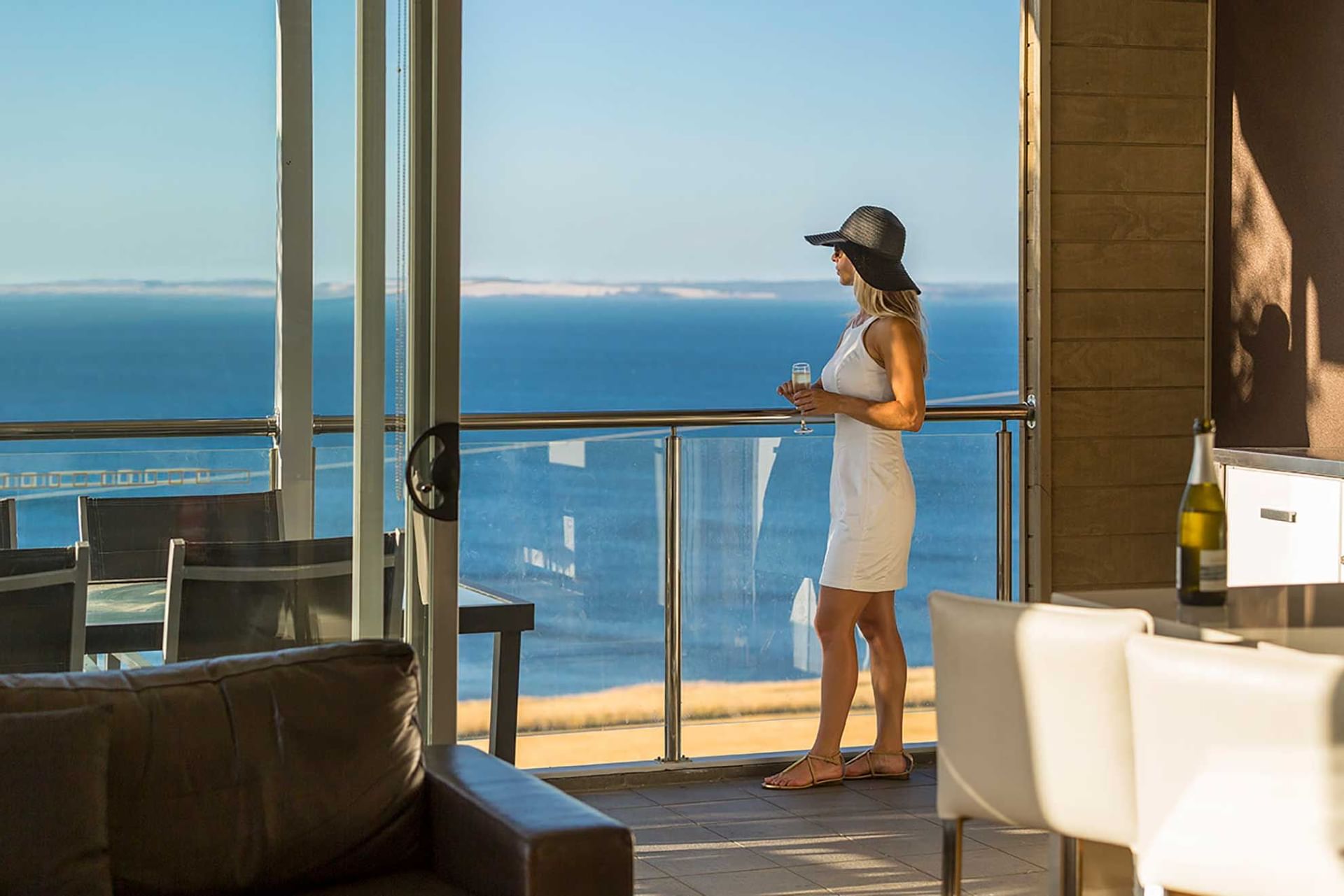 Girl on a balcony in 3 Bedroom Apartments at Silverwater Resort